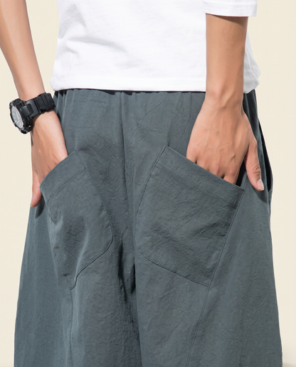 Men's Cotton Drawstring Pants with Pockets — pocket detail worn by a model