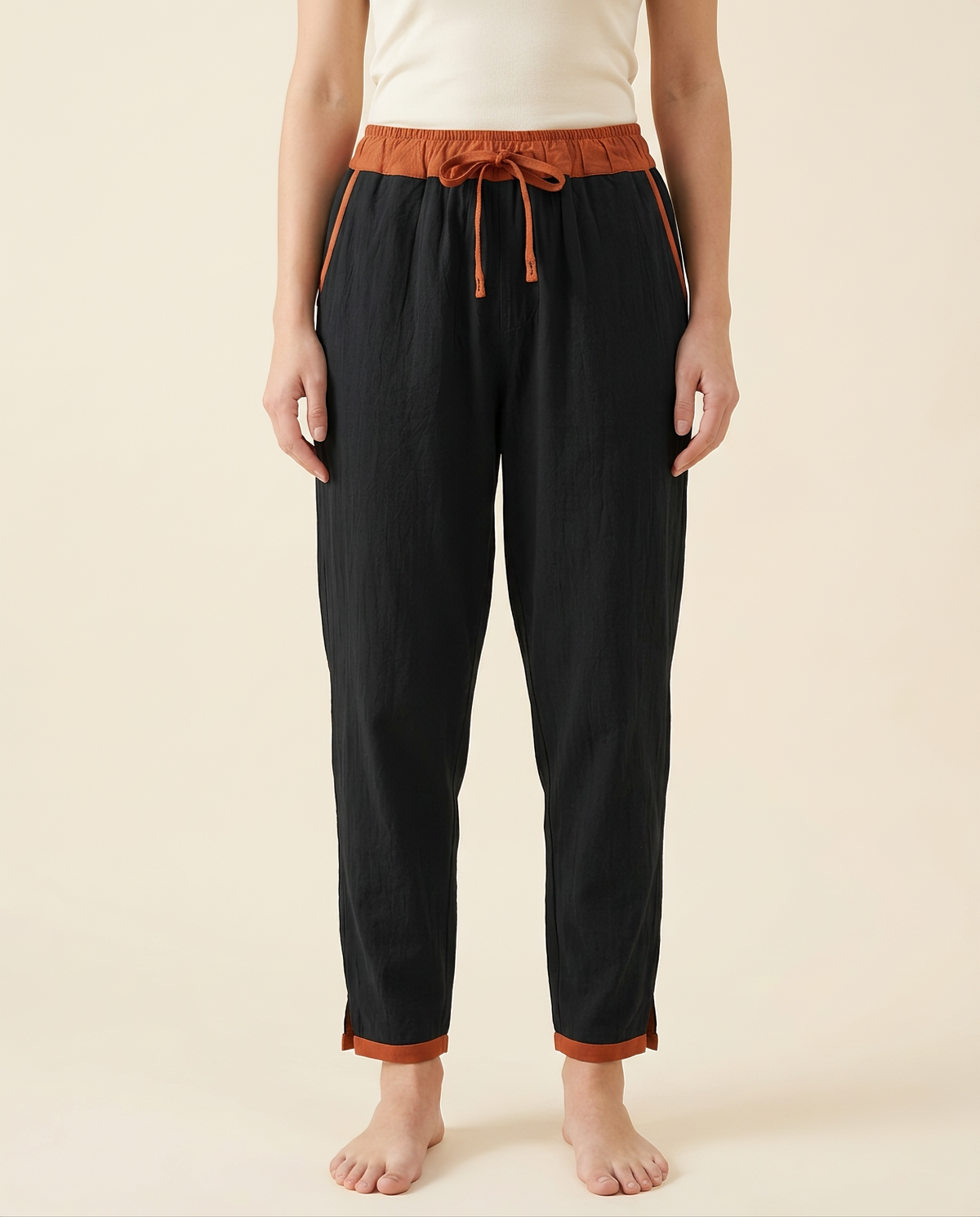 Cotton Drawstring Harem Pants with Pockets — in black, worn by a model