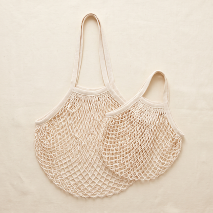 Two natural cotton mesh bags with long handles, one large and one small