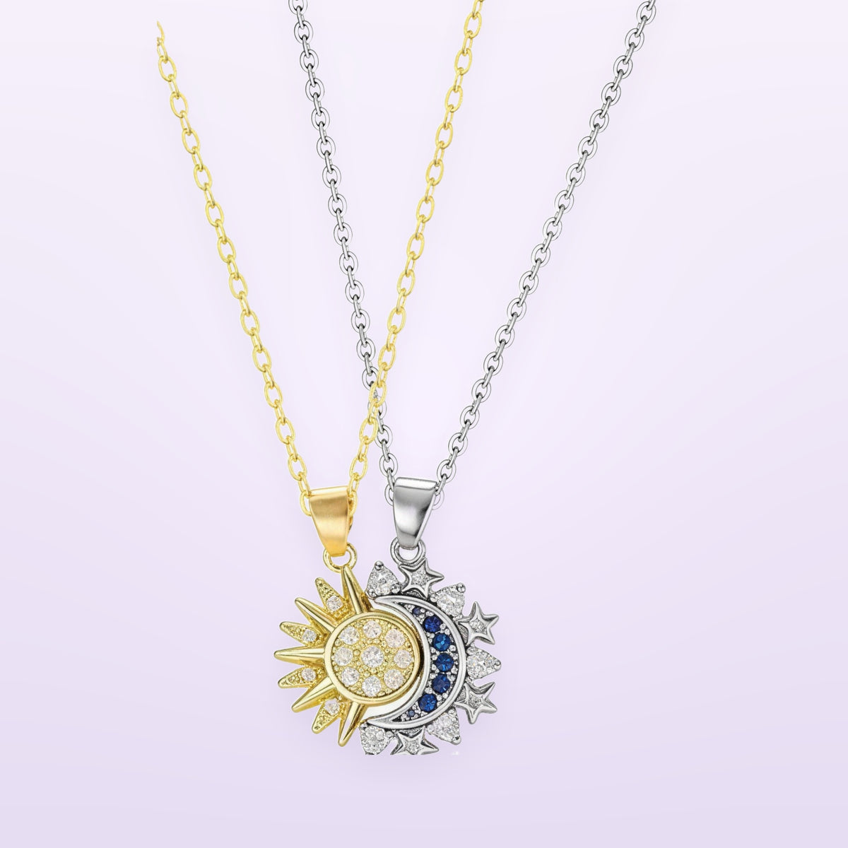 Two necklaces, a gold chain and a silver chain, hanging side by side