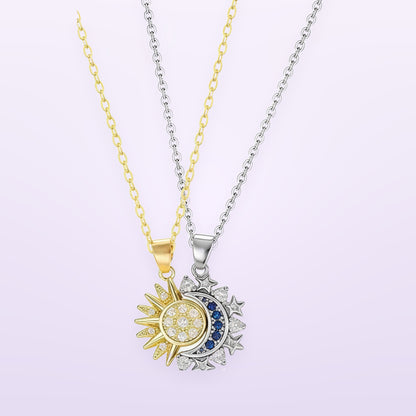 Two necklaces, a gold chain and a silver chain, hanging side by side